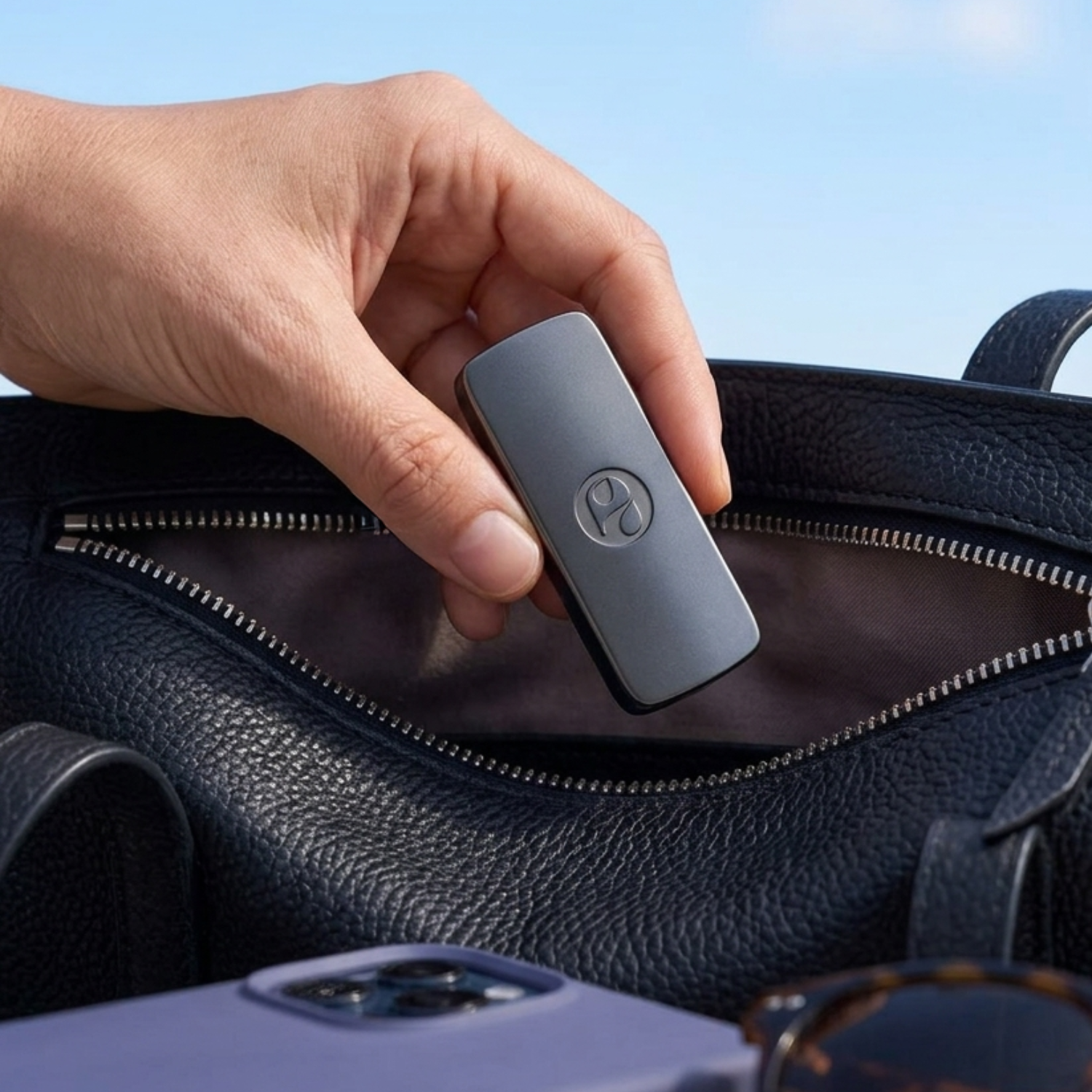 Olfinity gun metal diffuser case taken out of a handbag
